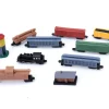 10 Figurines trains à vapeur dans un tube de rangement