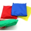 4 petits sacs tissus multicolores remplis de graines 12 x 12 cm