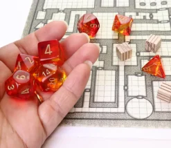 Set 7 dés multi-faces rouge et jaune translucide chiffres dorés